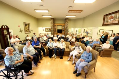 Residents gathering in a bright common area