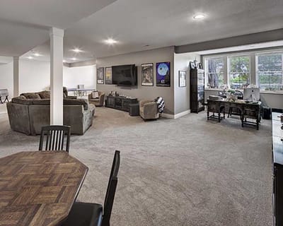 Spacious common area with seating and workstations
