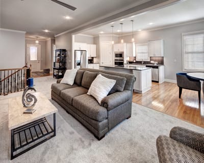 A spacious common area with a cozy sofa