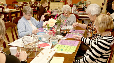 Residents engaged in a lively bingo game