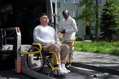 Pathfinder, Inc. Longwood ICF/IID, assisted living in Searcy, AR — Wheelchair user being assisted from a vehicle platform