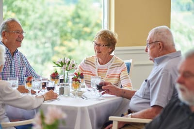 Residents enjoying a meal together in a dining area