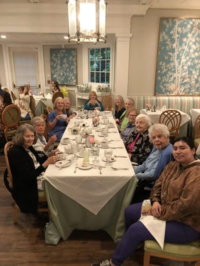 Residents enjoying a meal together in the dining room