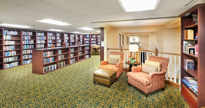 Cozy reading area with bookshelves and seating
