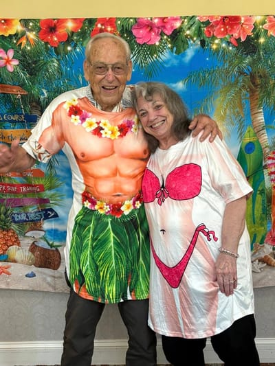 Residents enjoying a fun Hawaiian-themed celebration