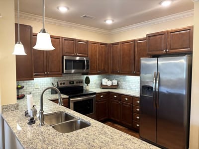 Modern kitchen with granite countertops and appliances