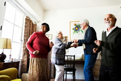 Residents enjoying a dance activity in a common area