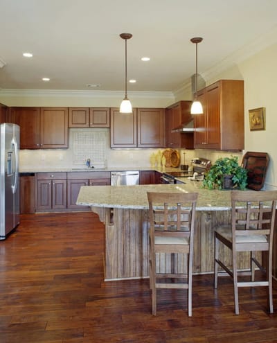 Bright interior kitchen space with wooden cabinetry