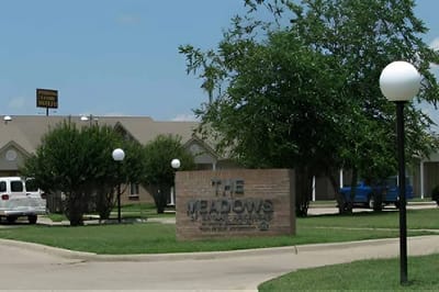 Exterior view of The Meadows senior living facility.