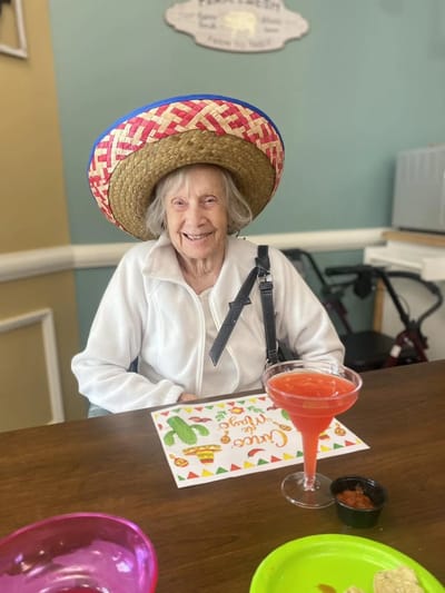 Resident enjoying a festive activity at the facility