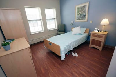 Private resident room with a bed and furnishings
