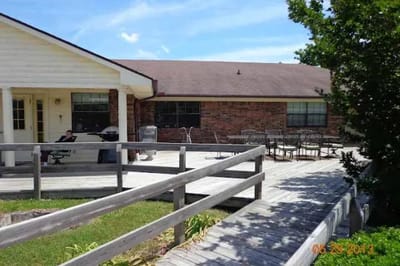 Cedar deck and building exterior of the facility