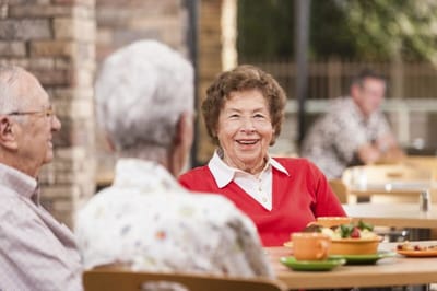Residents enjoying a meal in a common area