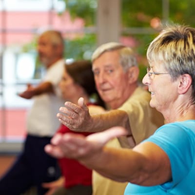 Residents participating in a group exercise class