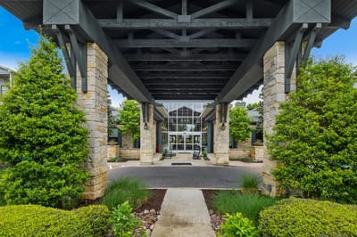 Entrance view of Chateau McKinney with landscaping