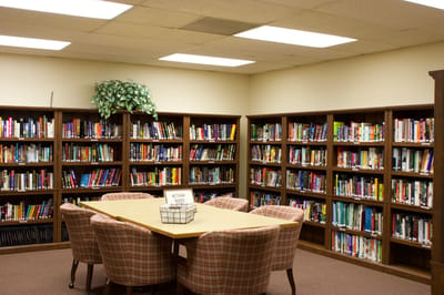 Cozy library with bookshelves and seating