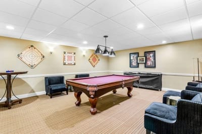 Interior activity room with a pool table