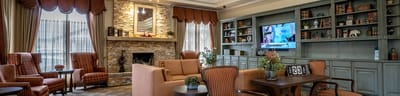 Cozy common area with seating and a fireplace
