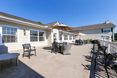 Outdoor seating area with tables and umbrellas