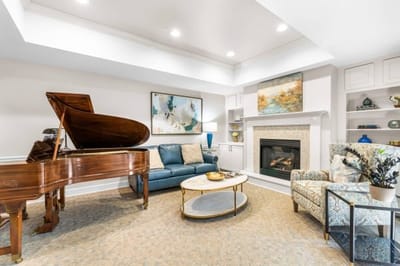 Cozy common area with a piano and seating