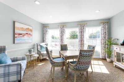 Bright interior common area with seating and natural light