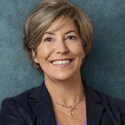 Pathfinder, Inc. Longwood ICF/IID, assisted living in Searcy, AR — Smiling woman in a professional setting with teal background