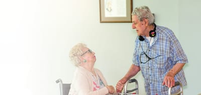 Elderly couple enjoying conversation indoors