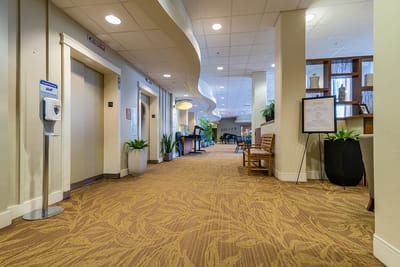 Interior hallway view with seating and plants