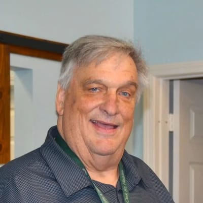 Smiling resident in a facility interior
