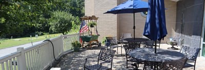 Outdoor patio area with tables and umbrellas