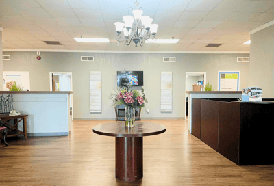 Bright interior view of facility lobby area with table