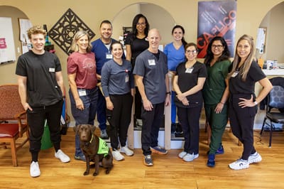 Staff posing together in a common area