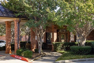 Exterior view of the facility entrance with landscaping