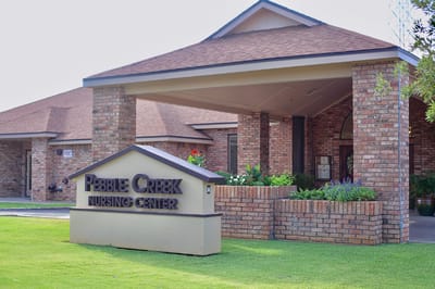 Exterior view of Pebble Creek Nursing Center entrance