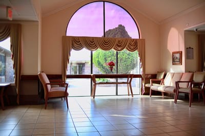 Bright interior view of a common area with large window