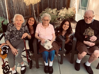 Residents enjoying time outdoors with staff members