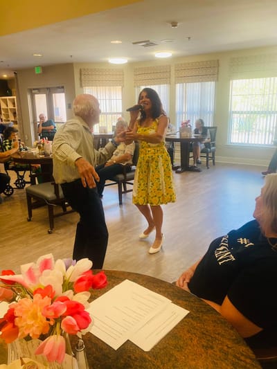 Residents dancing during a lively activity.