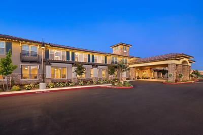 Exterior view of Oakmont of Westpark facility at dusk