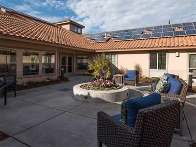 Courtyard seating area with solar panels and landscaping