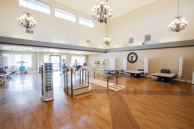 A bright activity room with exercise equipment