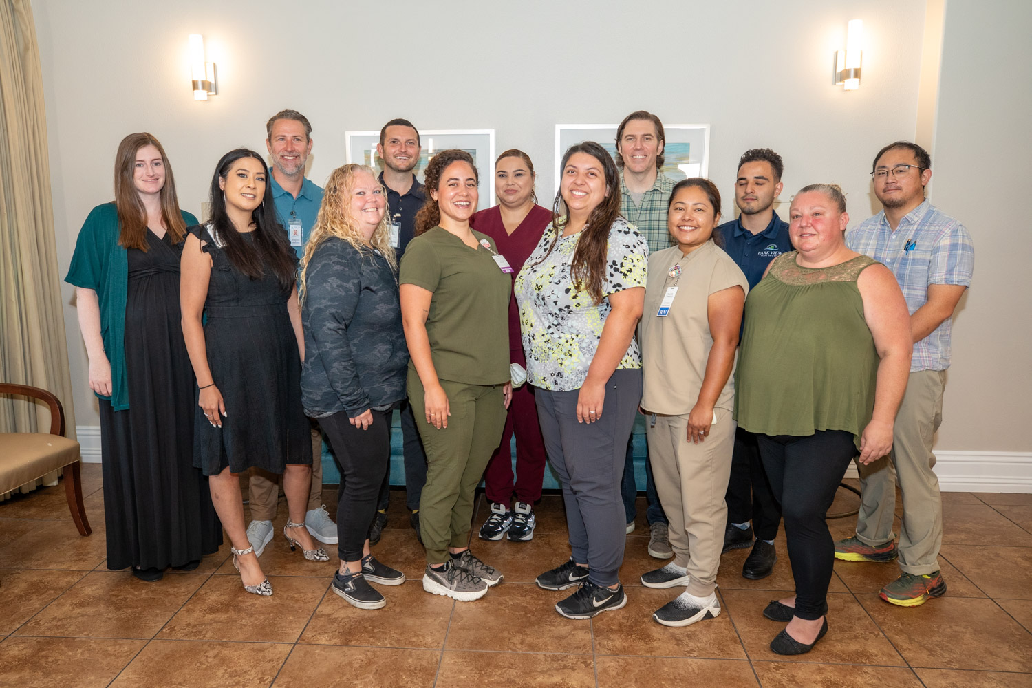 Staff posing together in a common area