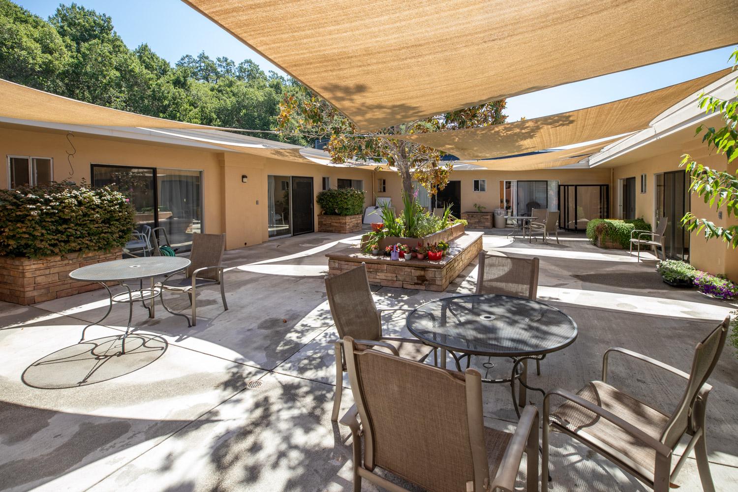Outdoor courtyard with shaded seating areas