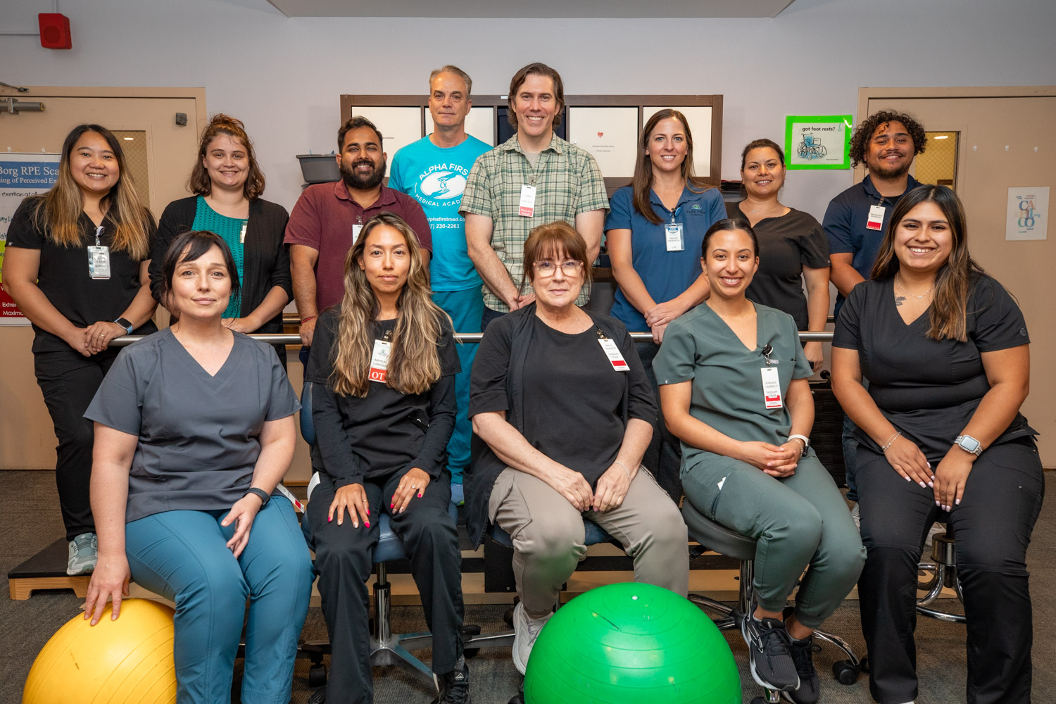 A group of staff members posing in an activity room