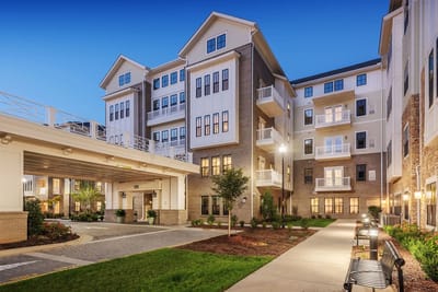 Exterior view of assisted living facility at dusk
