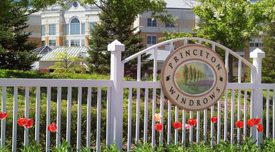 Sign for Princeton Windrows with flowers and greenery