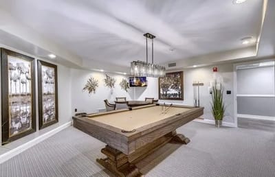 Interior view of a recreational room with a pool table