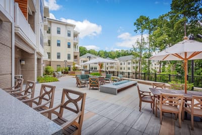 Outdoor patio area with seating and umbrellas