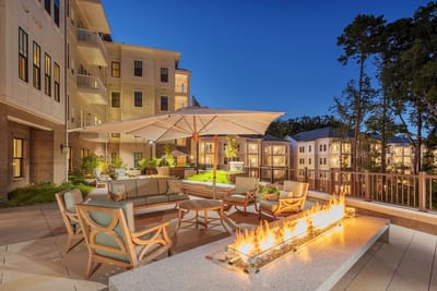 Outdoor patio area with fire feature and seating
