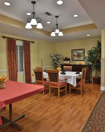 Interior dining area with tables and chairs set up