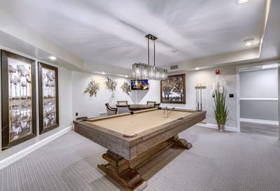 Interior photo of a game room with a pool table